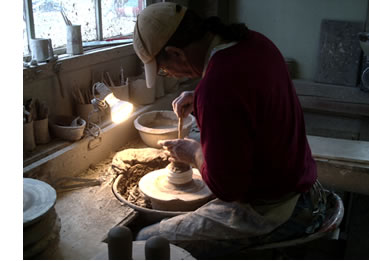 Tom White at Potters Wheel in Tom White Pottery Studio